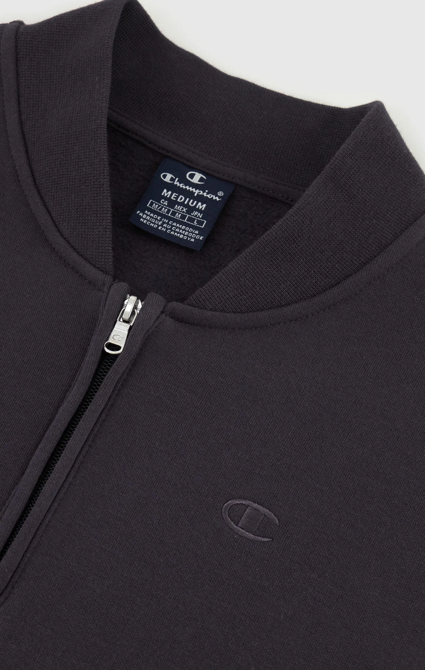 Sudadera con media cremallera y logotipo a tono